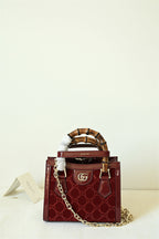 Gucci Diana Mini Tote Bag - Red in Red - detail view 9 showing the bag's shape, finish and visible design details.