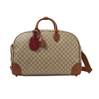 Gucci GG Canvas Medium Leather - Trimmed Duffel Bag in Beige - side view showing the bag's shape, material finish and visible design details.