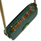 Gucci Diana Mini Top Handle Crossbody Bag - Green in Green - detail view 4 showing the bag's shape, finish and visible design details.