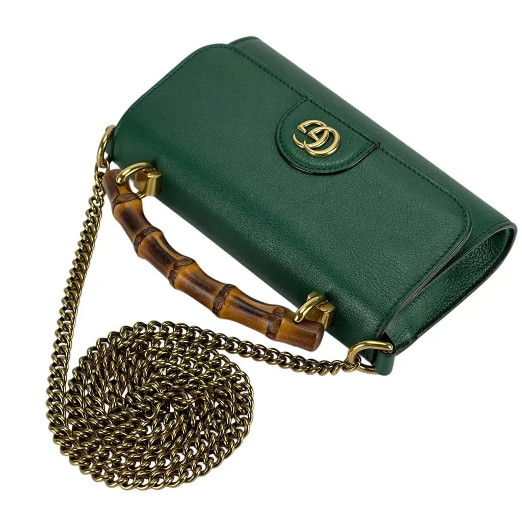Gucci Diana Mini Top Handle Crossbody Bag - Green in Green - detail view 6 showing the bag's shape, finish and visible design details.