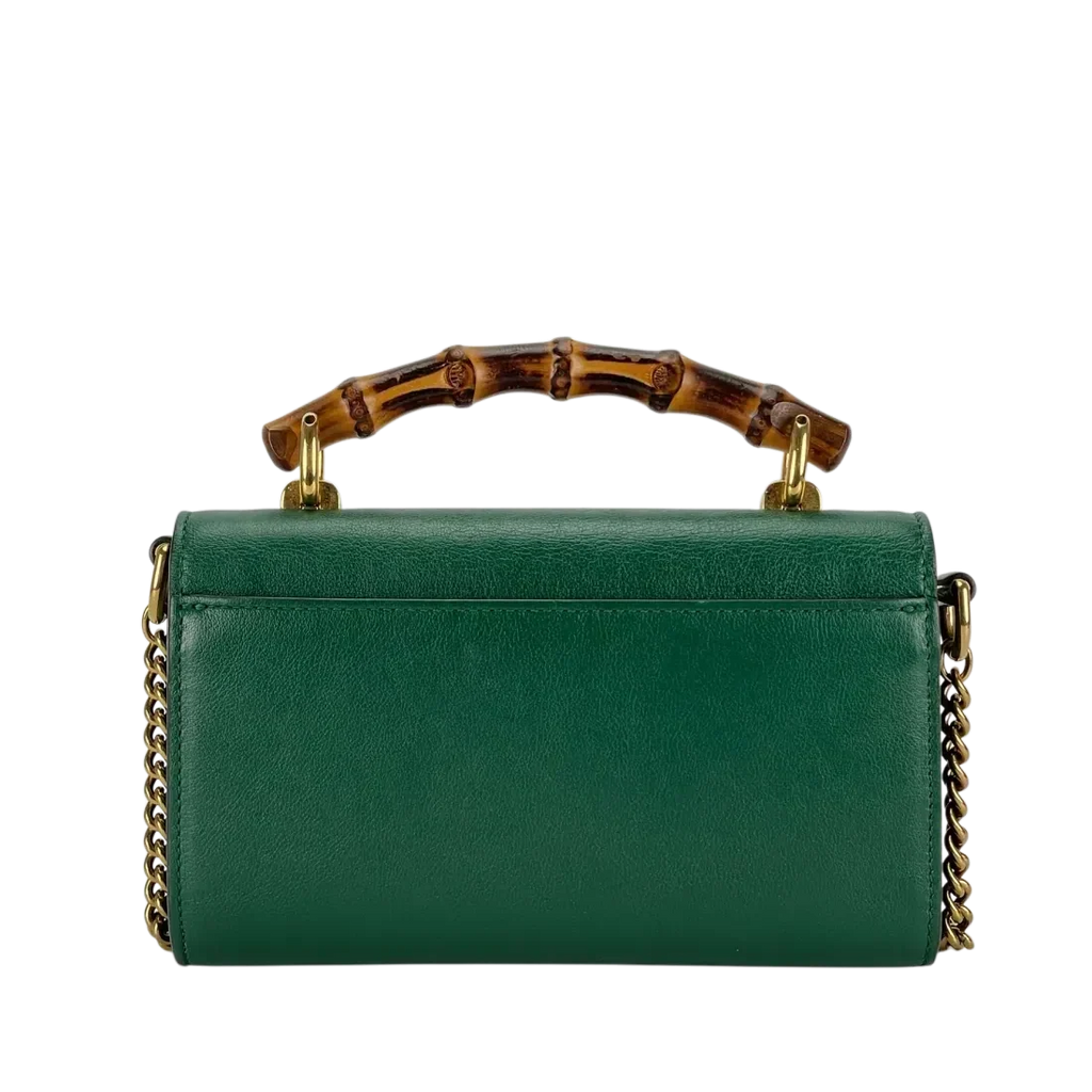 Gucci Diana Mini Top Handle Crossbody Bag - Green in Green - side view showing the bag's shape, finish and visible design details.