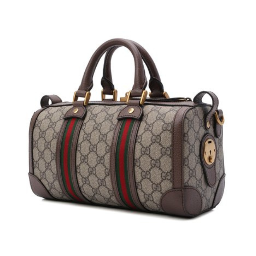 Gucci Canvas Leather Travel Duffle Bag - Beige in Beige - side view showing the bag's shape, finish and visible design details.