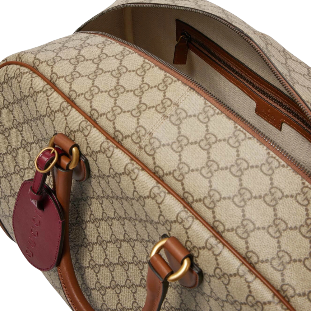 Gucci GG Canvas Medium Leather - Trimmed Duffel Bag in Beige - detail view 4 showing the bag's shape, material finish and visible design details.
