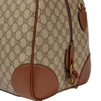 Gucci GG Canvas Medium Leather - Trimmed Duffel Bag in Beige - detail view 5 showing the bag's shape, material finish and visible design details.