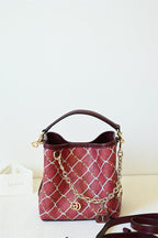 Gucci Emblem Small Bucket Bag - Red in Red - detail view 13 showing the bag's shape, material finish and visible design details.