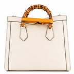 Gucci Diana Medium Tote Bag - Neutral in Neutral - side view showing the bag's shape, finish and visible design details.