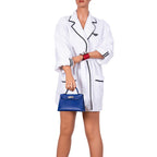 Mannequin wearing a white outfit with black accents holding a blue handbag on a white background