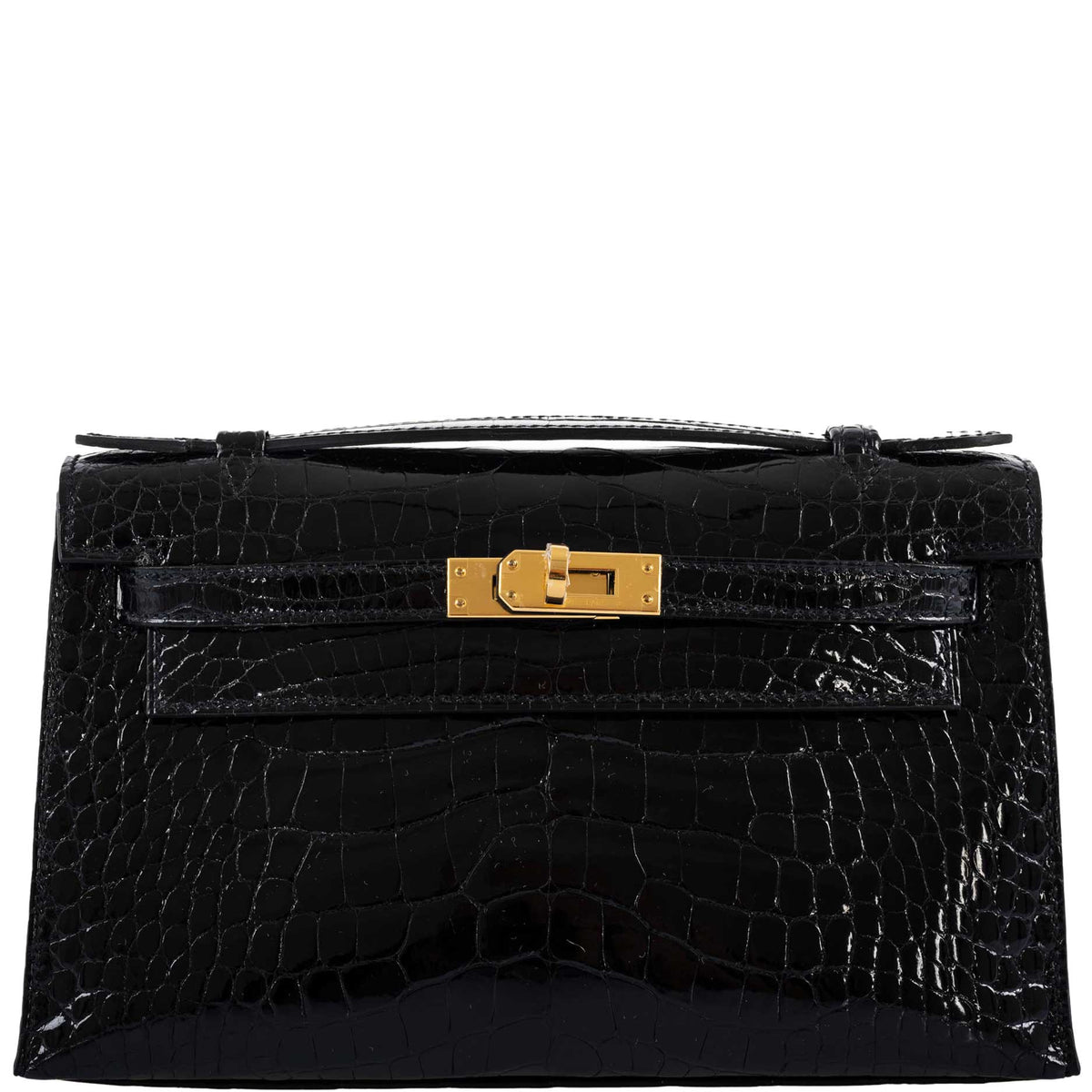 Black crocodile skin handbag with a gold clasp on a white background
