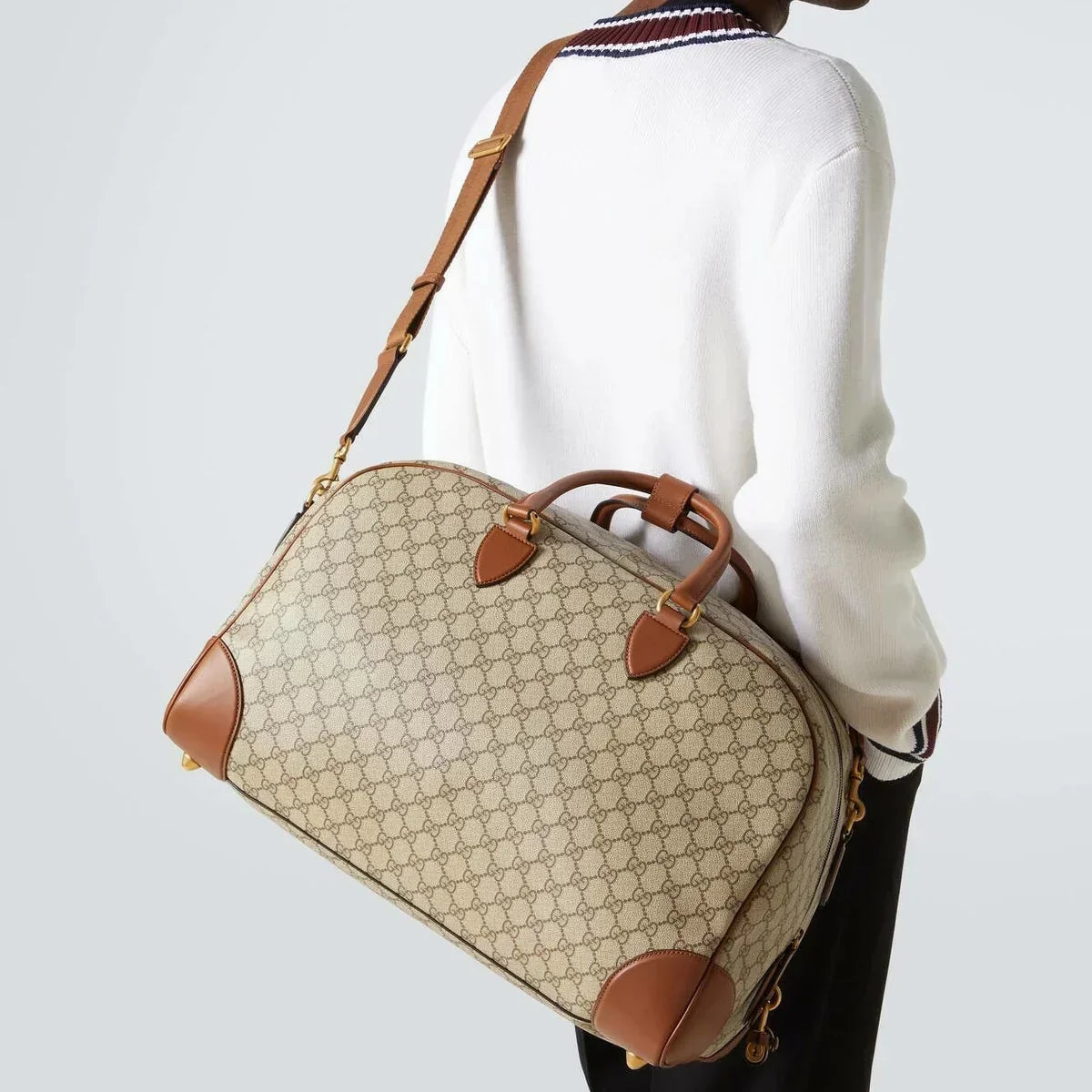 Gucci GG Canvas Medium Leather - Trimmed Duffel Bag in Beige - detail view 9 showing the bag's shape, material finish and visible design details.