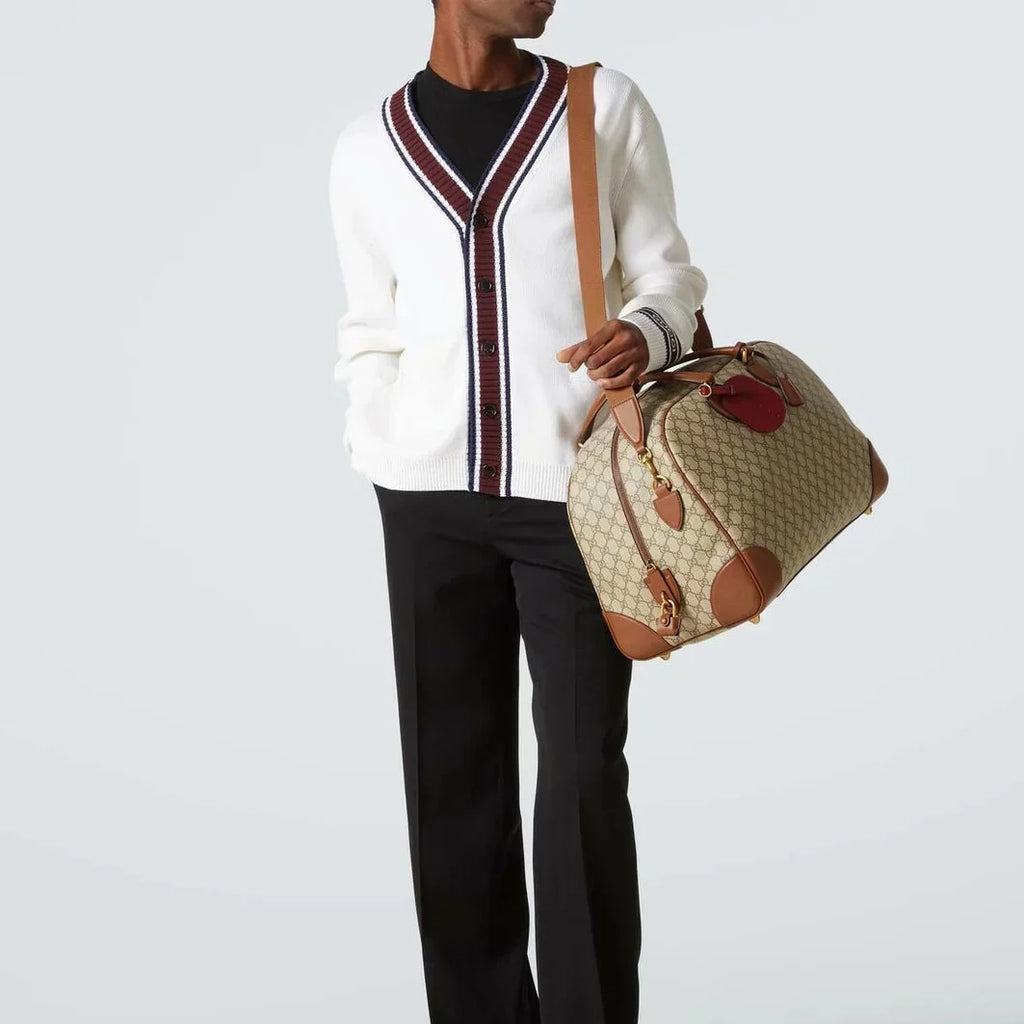 Gucci GG Canvas Medium Leather - Trimmed Duffel Bag in Beige - detail view 7 showing the bag's shape, material finish and visible design details.