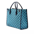 Gucci Calfskin Retro Tote Bag - Blue in Blue - side view showing the bag's shape, finish and visible design details.