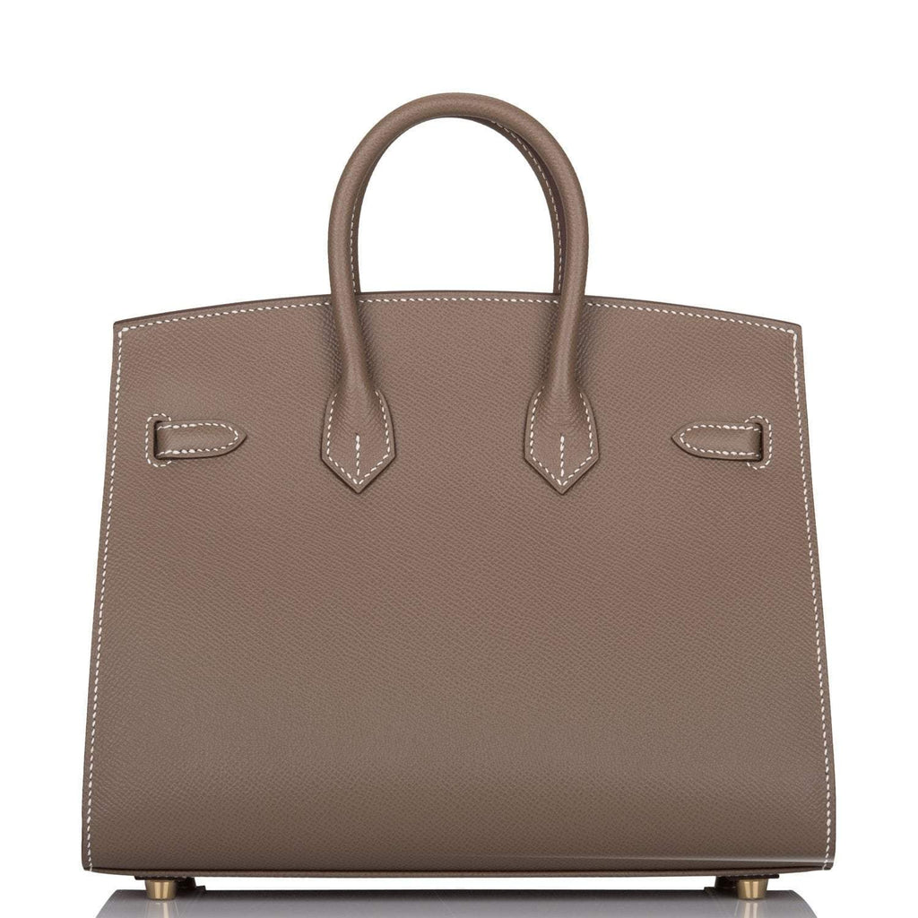 Side profile showing Sellier structure and gold hardware