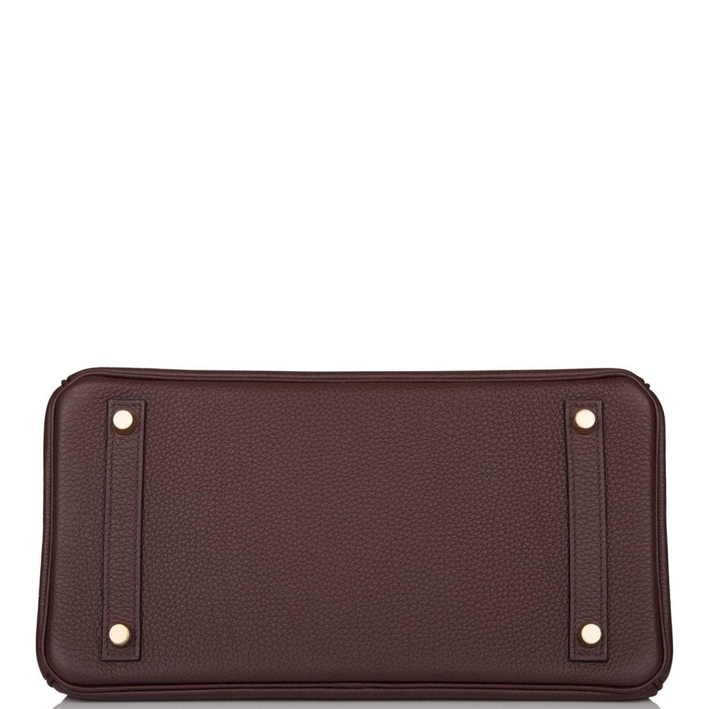 Chevre leather-lined interior with zip and slip pockets