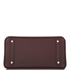 Chevre leather-lined interior with zip and slip pockets