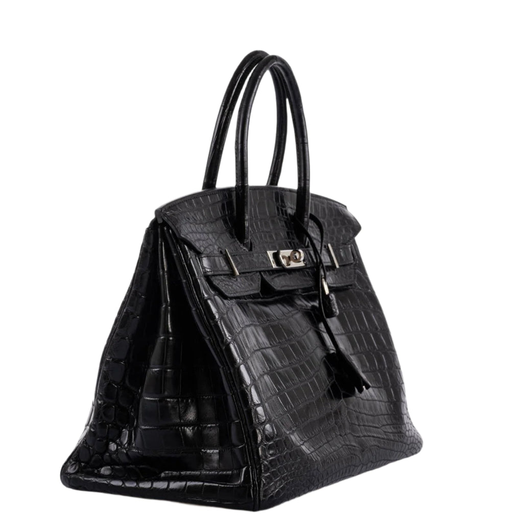 Detail of double rolled top handle on crocodile Birkin