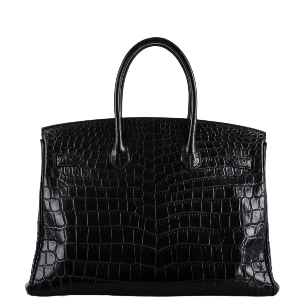 Birkin 35 in crocodile leather placed inside Hermes dustbag