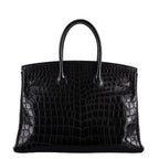 Birkin 35 in crocodile leather placed inside Hermes dustbag