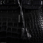 Bottom view of Birkin 35 showing protective studs and grain texture