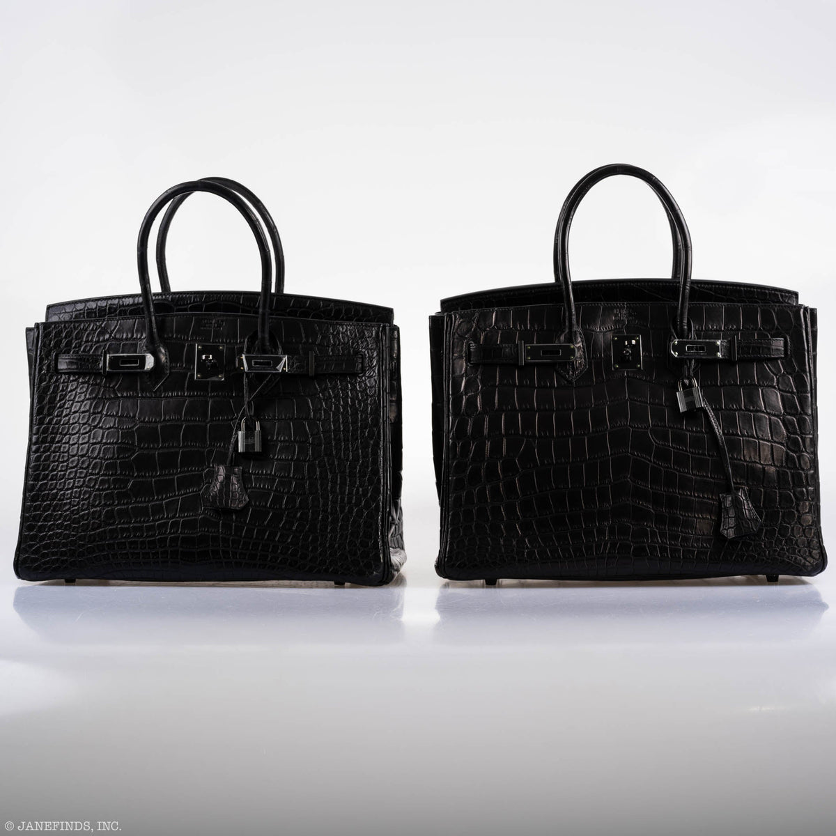 Flatlay of Hermes Birkin 35 SO BLACK with accessories including dustbag and lock