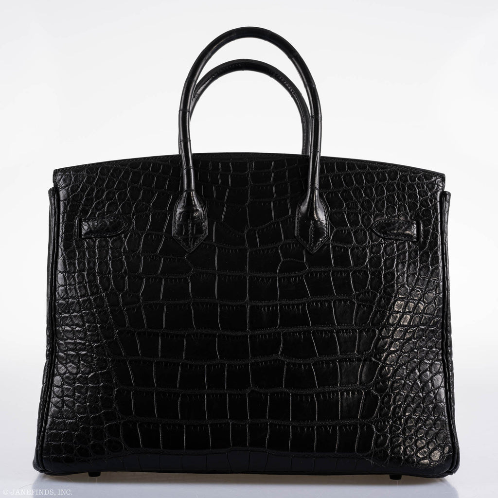 Open flap view showing clasp and matte interior leather