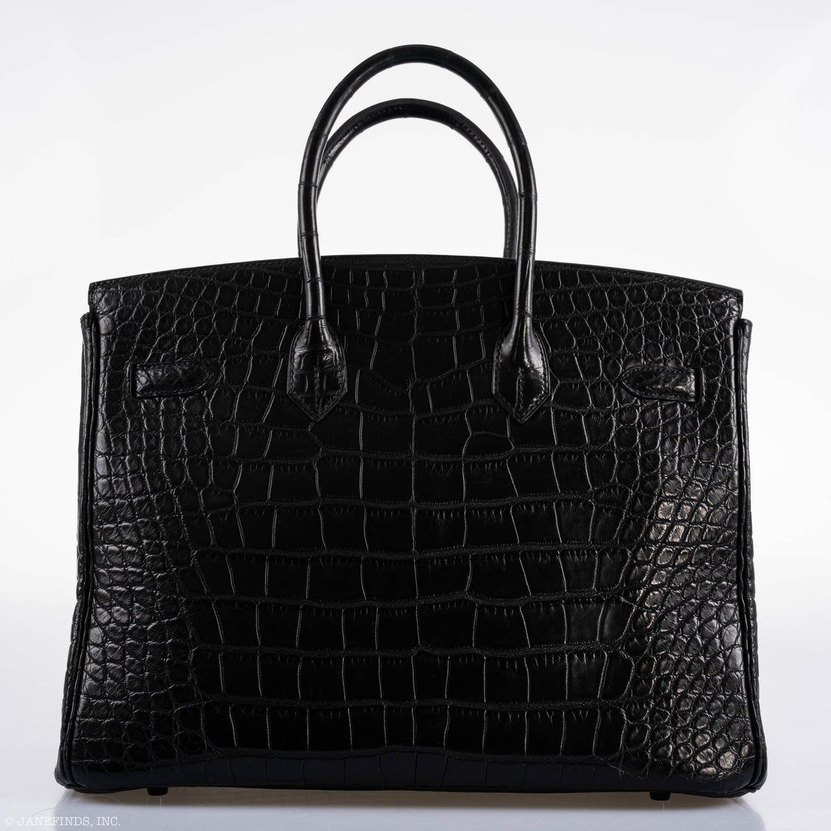 Open flap view showing clasp and matte interior leather