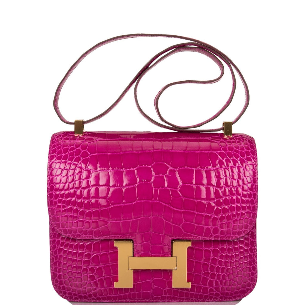 Hermes Constance 24cm handbag in Rose Scheherazade Shiny Alligator with gold hardware.