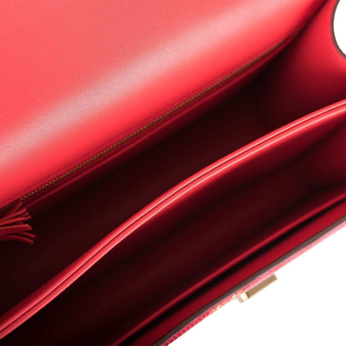 Detail view of gold hardware on Hermes Constance 24 Rouge Exotique