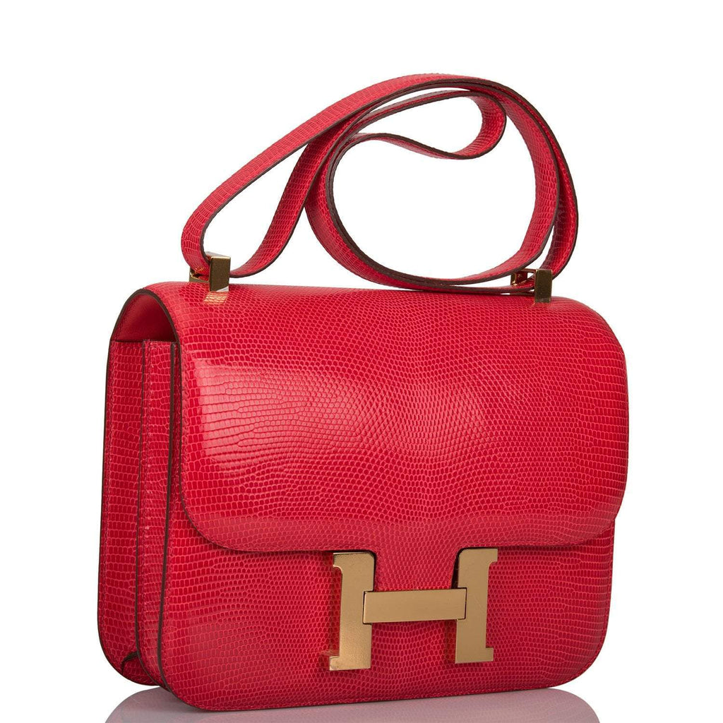 Side profile of Hermes Constance 24 in Rouge Exotique with gold hardware