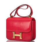 Adjustable strap on Hermes Rouge Exotique Lizard Constance 24