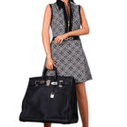 Side profile of oversized HAC Birkin with rolled handles