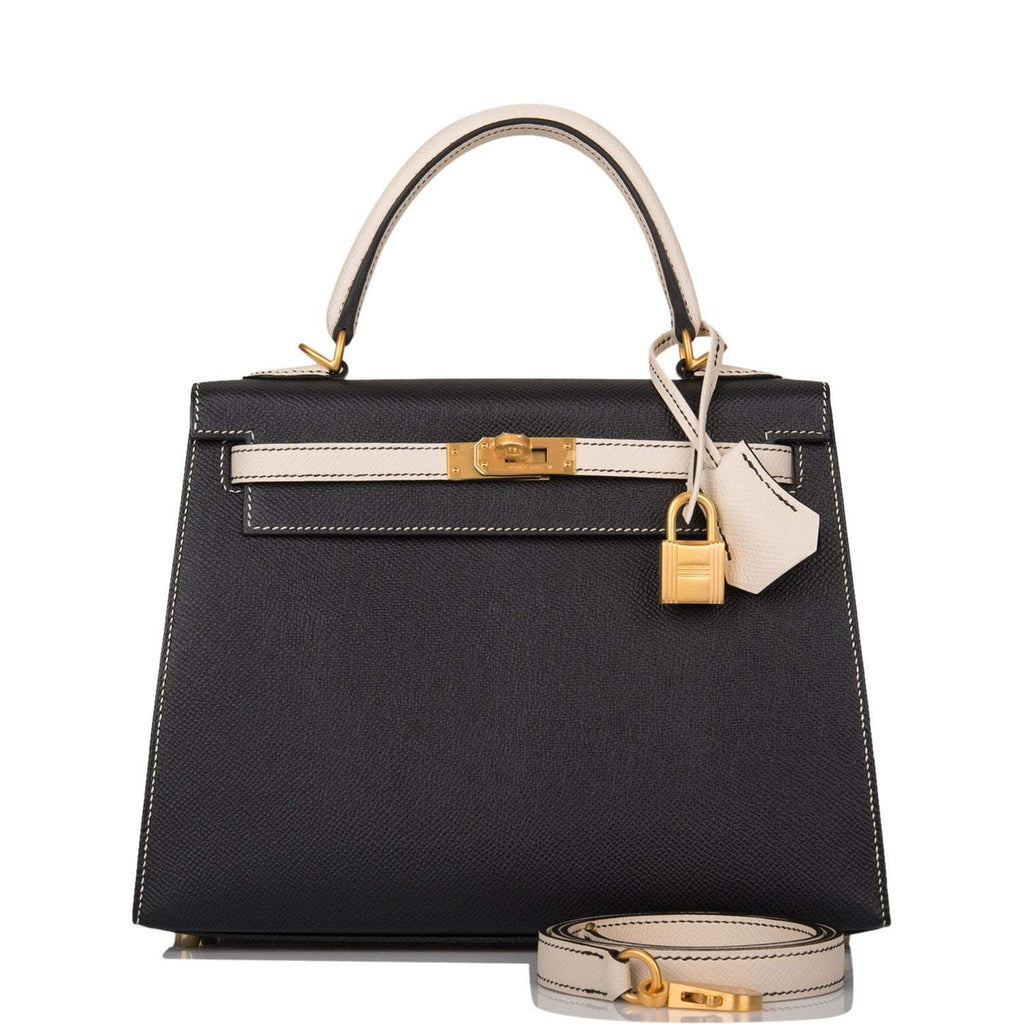 Hermes Kelly 25 Bi-Color Sellier handbag in Black and Craie Epsom leather with brushed gold hardware.

