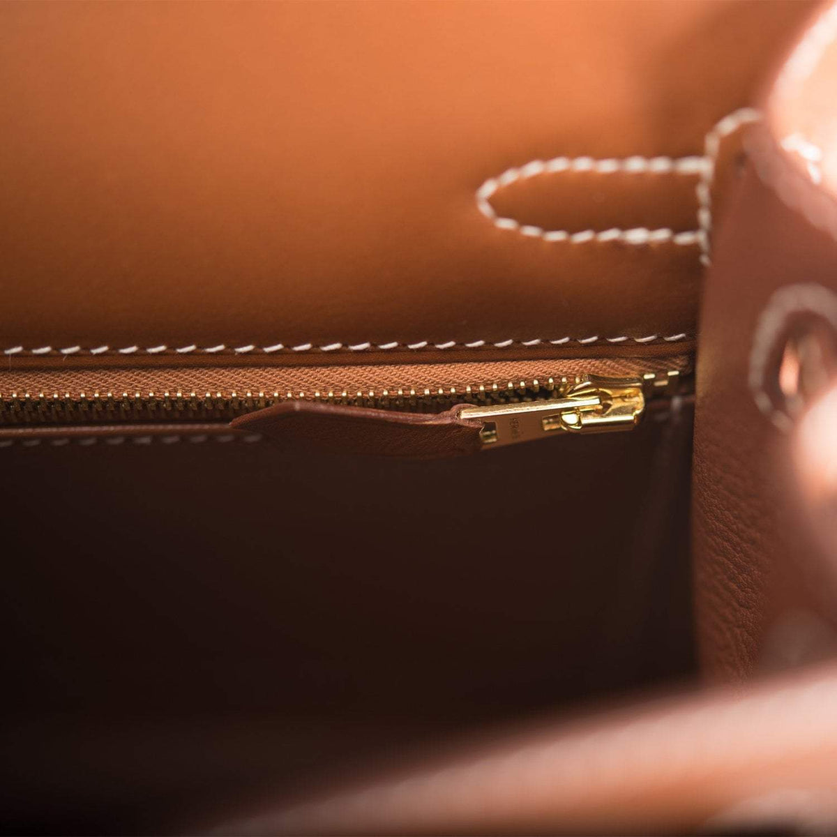 Close-up of gold hardware and lock on Hermes Kelly 25