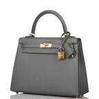 Side profile of Kelly 25cm in gray-green with gold hardware