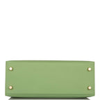 Open view of gold hardware and toggle closure on Hermes Kelly 25