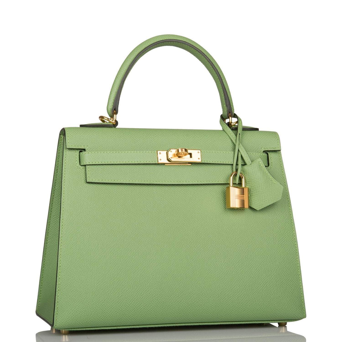 Side profile of Hermes Kelly 25 green bag with gold hardware