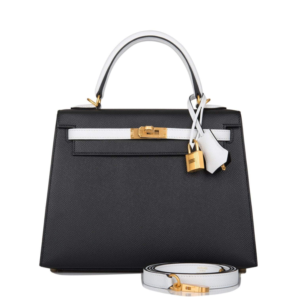 Hermes Kelly 28 Bi-Color Sellier handbag in Black and Craie Epsom leather with brushed gold hardware.