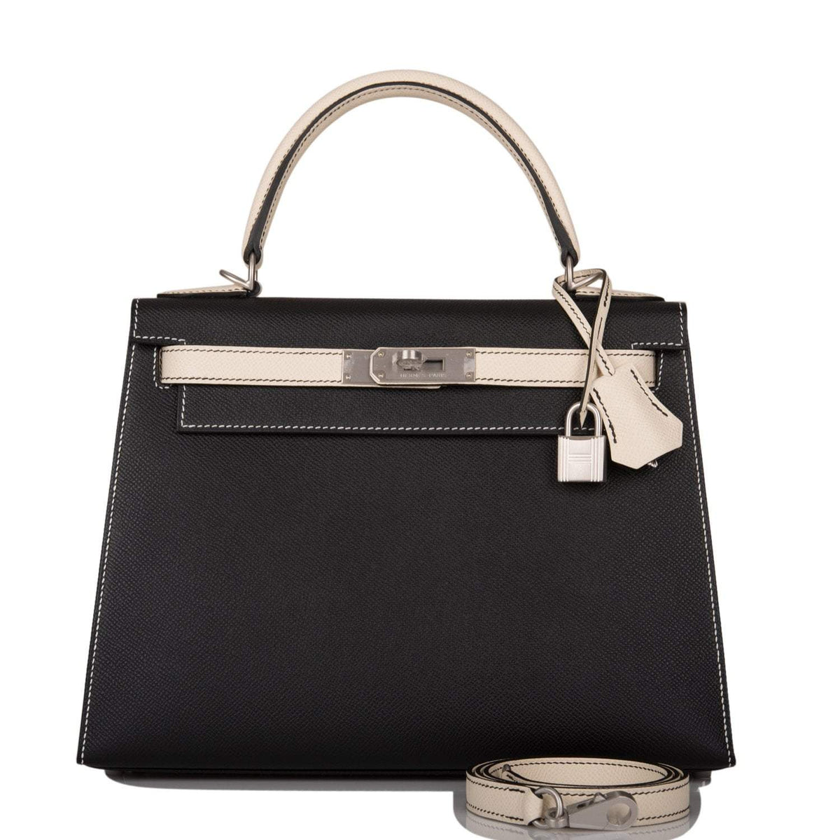 Hermes Kelly 28 Bi-Color Sellier handbag in Black and Craie Epsom leather with brushed palladium hardware.