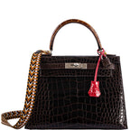 A close-up of the lock and clochette in Rose Extreme alligator