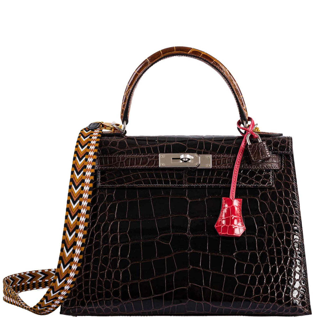 A close-up of the lock and clochette in Rose Extreme alligator
