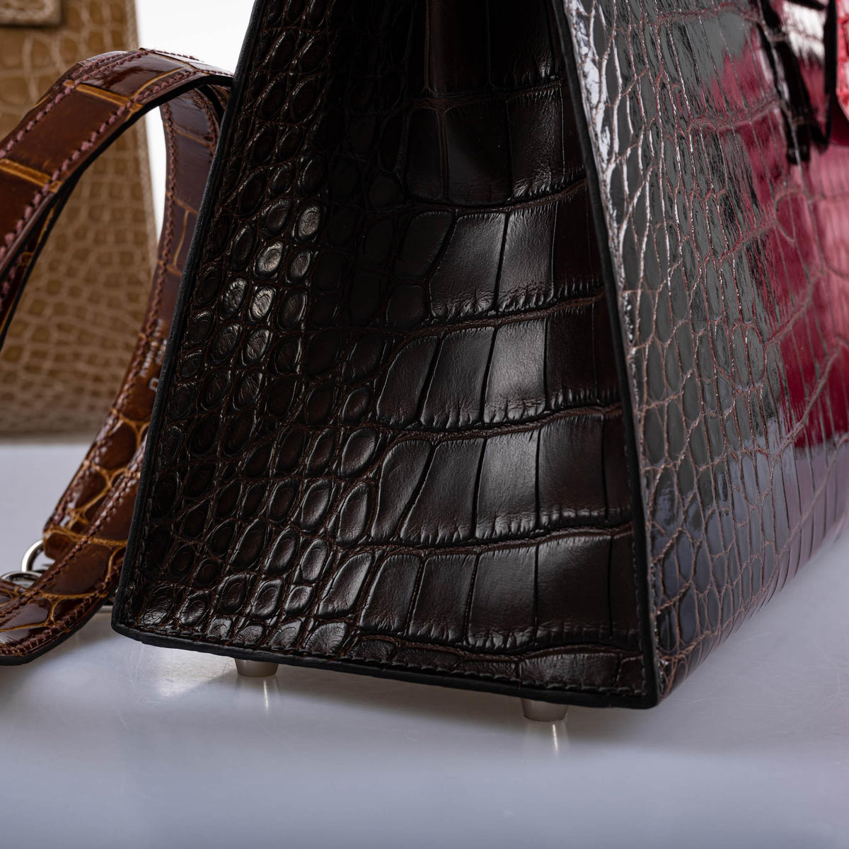 A detail of the stitching on the structured Sellier bag