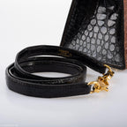 The base of the vintage bag, showing the gold feet