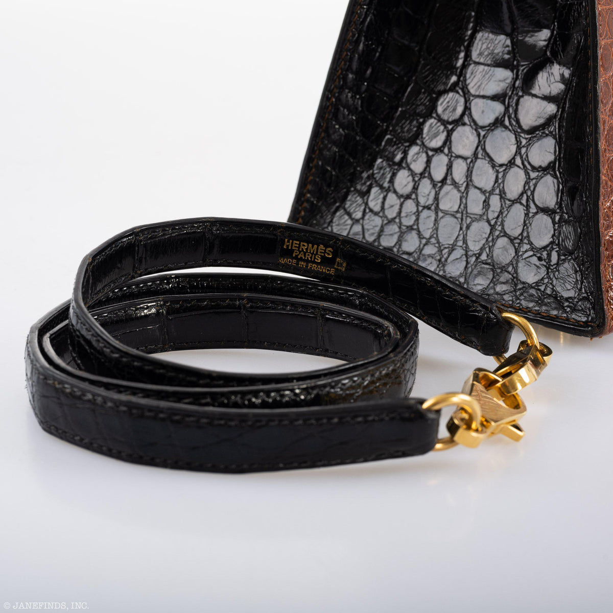 The base of the vintage bag, showing the gold feet