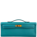 Hermes Kelly Cut clutch bag in Blue Paon Swift leather with gold hardware.