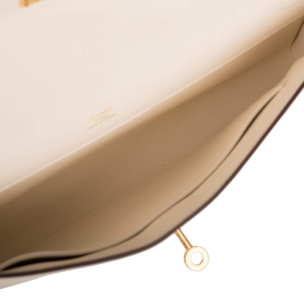 The Hermes Kelly Cut in Nata Swift leather with its accompanying ribbon