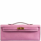 Front view of the Hermes Kelly Cut Pochette in 5P Bubblegum Pink Matte Porosus Crocodile