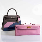 Detailed image of the gold-tone hardware on the Hermes Kelly Cut Pochette