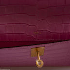 Side view of the Hermes Kelly Cut Pochette, highlighting its structured silhouette