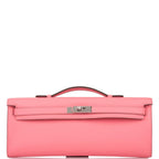 The Hermes Kelly Cut in Rose D'ete being carried on the wrist