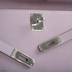 Back view of Rose Dragee Hermes Kelly Longue Evergrain leather clutch.