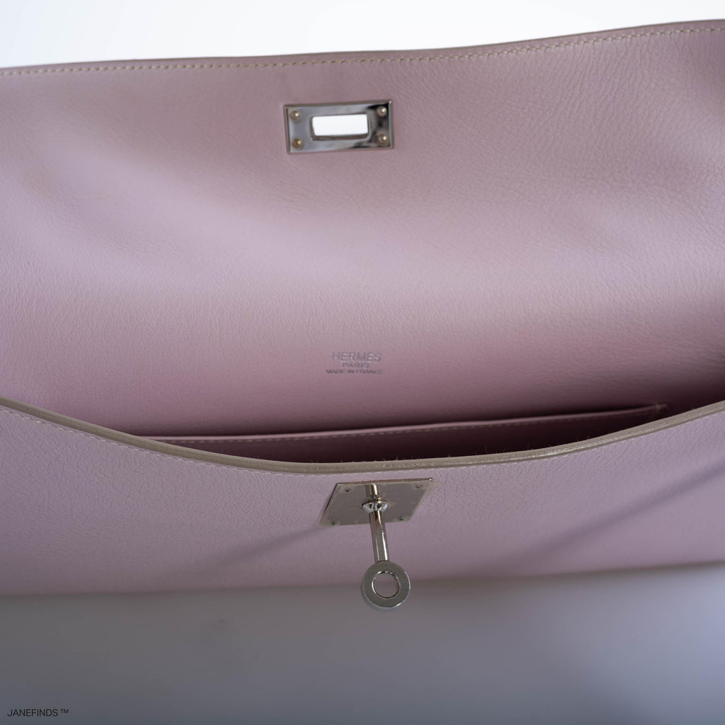 Front view of Hermes Kelly Longue in Rose Dragee Evergrain leather with palladium hardware.